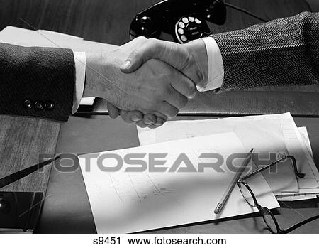 1940S Hands Close-Up Two Businessmen Shaking Hands Across A Desktop View Large Photo Image Stock Image - 1940S Hands Close-Up Two Businessmen Shaking Hands Across A Desktop. Fotosearch