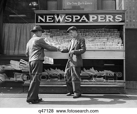 1940S Man Buying Newspaper From Vendor On Sidewalk New York City View Large Photo Image Stock Photo - 1940S Man Buying Newspaper From Vendor On Sidewalk New York City. Fotosearch
