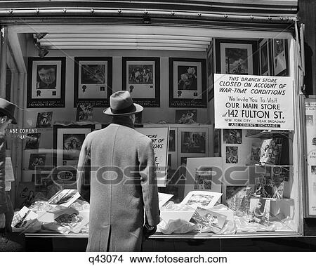 1940S Man Looking In Window Of New York City Store With Sign Explaining Closed Due To War Time Conditions View Large Photo Image Picture - 1940S Man Looking In Window Of New York City Store With Sign Explaining Closed Due To War Time Conditions. Fotosearch