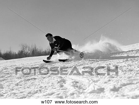 1940S Man Skiing Downhill Racing Fast Snow Flying Winter Outdoor View Large Photo Image Stock Photo - 1940S Man Skiing Downhill Racing Fast Snow Flying Winter Outdoor. Fotosearch