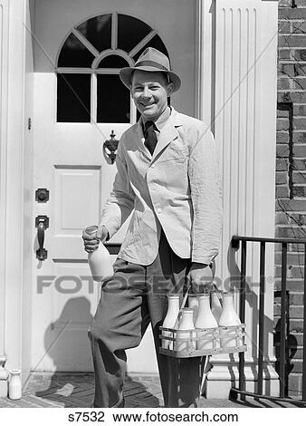 1940S Milkman Smiling At Camera On Doorstep Delivering Milk View Large Photo Image Stock Image - 1940S Milkman Smiling At Camera On Doorstep Delivering Milk. Fotosearch