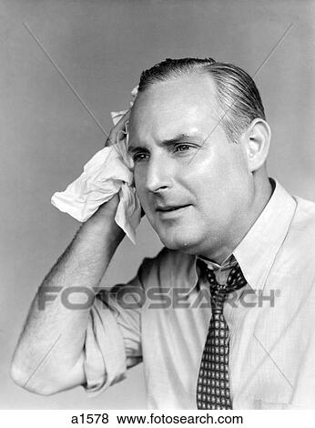 1940S Overheated Man With Open Shirt And Tie Holding A Handkerchief To His Temple View Large Photo Image Stock Photo - 1940S Overheated Man With Open Shirt And Tie Holding A Handkerchief To His Temple. Fotosearch