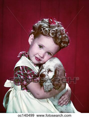 1940s Portrait Girl Wearing Plaid Dress Hugging Cocker Spaniel