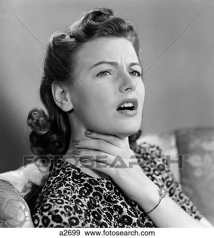 1940S Portrait Of Woman Holding Her Sore Throat With Expression Of Discomfort And Pain View Large Photo Image Stock Photo - 1940S Portrait Of Woman Holding Her Sore Throat With Expression Of Discomfort And Pain. Fotosearch