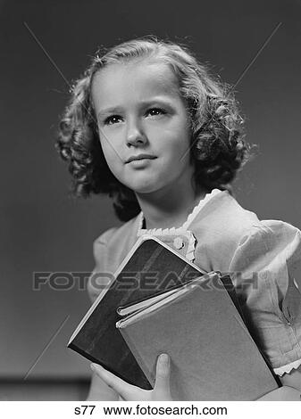 Stock Photo - 1940S Portrait Serious Girl Student Holding School Books. Fotosearch