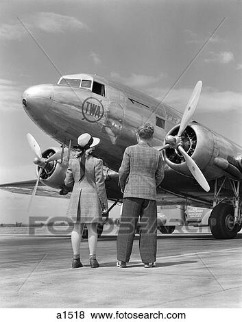 1940S Rear View Of Boy & Girl Standing Together Looking At Propeller Airplane Outdoor View Large Photo Image Stock Photo - 1940S Rear View Of Boy & Girl Standing Together Looking At Propeller Airplane Outdoor. Fotosearch