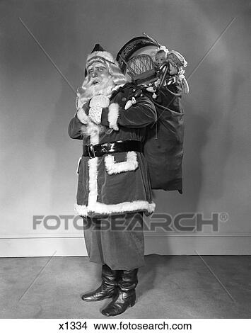 1940S Santa Claus Carrying Bag Full Of Toys On His Back View Large Photo Image Picture - 1940S Santa Claus Carrying Bag Full Of Toys On His Back. Fotosearch