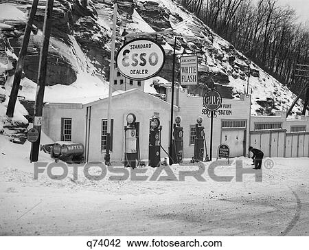 1940S Service Station In Mountains In Winter Several Gas Pumps Garages & Oil & Gas Signs View Large Photo Image Stock Image - 1940S Service Station In Mountains In Winter Several Gas Pumps Garages & Oil & Gas Signs. Fotosearch