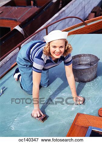 1940S Smiling Blond Teen Wearing Sailor Outfit Scrubbing Ship Deck View Large Photo Image Stock Photo - 1940S Smiling Blond Teen Wearing Sailor Outfit Scrubbing Ship Deck. Fotosearch