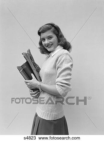 1940S Smiling Brunette Teen Student Wearing Sweater Carrying School Books View Large Photo Image Stock Image - 1940S Smiling Brunette Teen Student Wearing Sweater Carrying School Books . Fotosearch