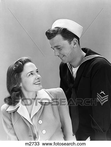 1940S Smiling Couple Man Woman Navy Uniform View Large Photo Image Stock Image - 1940S Smiling Couple Man Woman Navy Uniform. Fotosearch