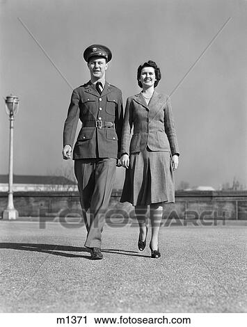 1940S Smiling Couple Walking Forward Man In Army Uniform View Large Photo Image Stock Image - 1940S Smiling Couple Walking Forward Man In Army Uniform. Fotosearch