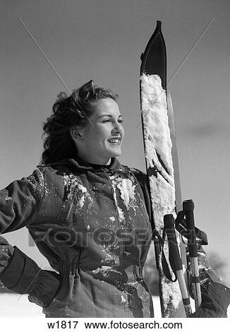 1940S Smiling Woman Portrait Holding Skis And Ski Poles Winter Outdoor View Large Photo Image Stock Photo - 1940S Smiling Woman Portrait Holding Skis And Ski Poles Winter Outdoor. Fotosearch