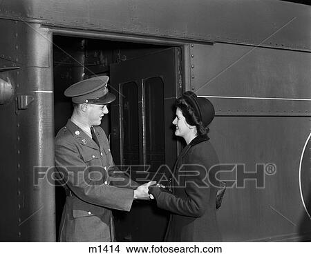 1940S Soldier Saying Goodbye To Woman At Train Station View Large Photo Image Picture - 1940S Soldier Saying Goodbye To Woman At Train Station. Fotosearch