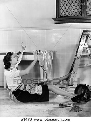 1940S Woman Housewife Falling From Step Ladder In Kitchen While Washing Window View Large Photo Image Stock Photograph - 1940S Woman Housewife Falling From Step Ladder In Kitchen While Washing Window. Fotosearch