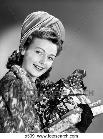 1940S Woman In Fur Coat Holding Stack Of Christmas Presents View Large Photo Image Stock Photo - 1940S Woman In Fur Coat Holding Stack Of Christmas Presents. Fotosearch