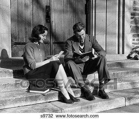 1940S Young Couple Sitting On Steps With Schoolbooks And Papers Smiling Outdoor View Large Photo Image Stock Image - 1940S Young Couple Sitting On Steps With Schoolbooks And Papers Smiling Outdoor. Fotosearch