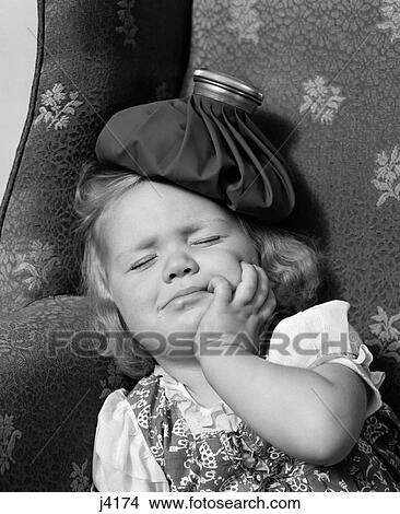 Picture - 1940S Young Girl With Ice Pack On Head Sleeping. Fotosearch
