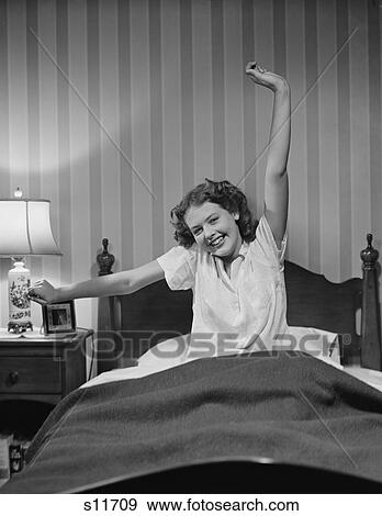 1940S Young Woman In Bed Stretching Waking Up View Large Photo Image Stock Photo - 1940S Young Woman In Bed Stretching Waking Up . Fotosearch