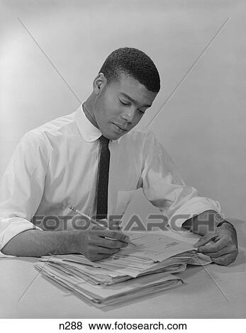 1950S 1960S African-American Man Working At Office Desk View Large Photo Image Stock Photo - 1950S 1960S African-American Man Working At Office Desk. Fotosearch