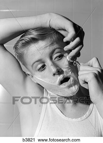 Stock Image - 1950S 1960S Boy Shaving First Time. Fotosearch