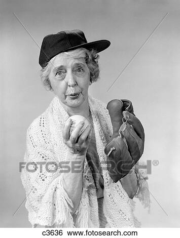 1950S 1960S Granny Wearing Baseball Hat & Glove About To Pitch Ball Looking At Camera View Large Photo Image Stock Photograph - 1950S 1960S Granny Wearing Baseball Hat & Glove About To Pitch Ball Looking At Camera. Fotosearch