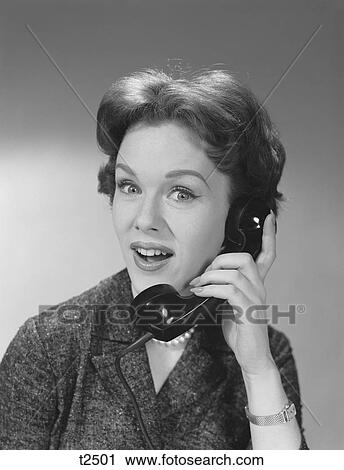 Stock Image - 1950S 1960S Happy Smiling Woman Having Telephone Conversation. Fotosearch