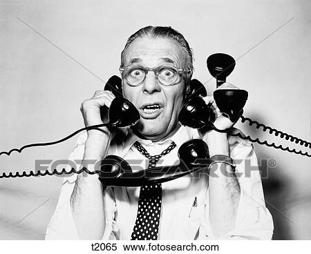 1950S 1960S Portrait Of Frazzled Businessman Trying To Answer Four Black Telephones Phones At Once View Large Photo Image Stock Photography - 1950S 1960S Portrait Of Frazzled Businessman Trying To Answer Four Black Telephones Phones At Once. Fotosearch