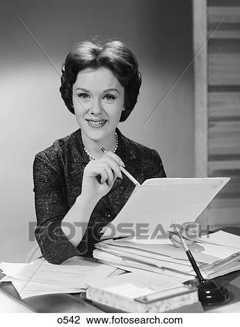 1950S 1960S Portrait Smiling Executive Woman Holding Files Papers Looking At Camera View Large Photo Image Stock Image - 1950S 1960S Portrait Smiling Executive Woman Holding Files Papers Looking At Camera. Fotosearch