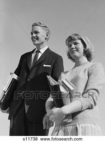 1950S 1960S Portrait Teenage Boy Girl Holding School Books View Large Photo Image Stock Photo - 1950S 1960S Portrait Teenage Boy Girl Holding School Books. Fotosearch