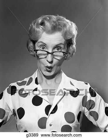 1950S 1960S Portrait Woman Polka Dot Dress Looking Over Eyeglasses View Large Photo Image Stock Photo - 1950S 1960S Portrait Woman Polka Dot Dress Looking Over Eyeglasses. Fotosearch