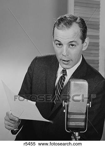 1950S 1960S Serious Man Speaking Into Microphone Holding Papers Newsman Announcer Broadcaster View Large Photo Image Stock Photography - 1950S 1960S Serious Man Speaking Into Microphone Holding Papers Newsman Announcer Broadcaster. Fotosearch