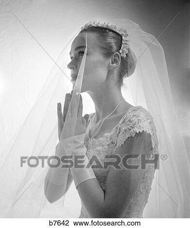 1950S 1960S Side View Of Bride With Hands Together Praying Looking Upward View Large Photo Image Stock Image - 1950S 1960S Side View Of Bride With Hands Together Praying Looking Upward. Fotosearch