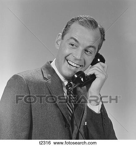 Stock Photograph - 1950S 1960S Smiling Business Man Telephone Conversation. Fotosearch