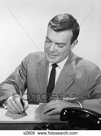 1950S 1960S Smiling Businessman At Desk Writing Checks View Large Photo Image Stock Photography - 1950S 1960S Smiling Businessman At Desk Writing Checks. Fotosearch