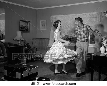 1950S 1960S Teen Couple Dancing Jitterbug In Living Room View Large Photo Image Stock Image - 1950S 1960S Teen Couple Dancing Jitterbug In Living Room. Fotosearch
