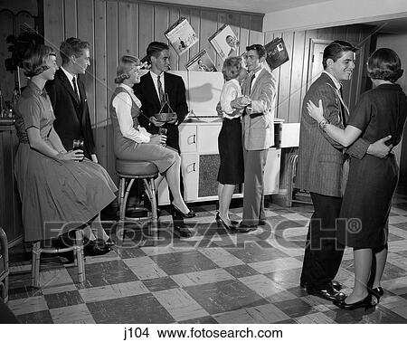 1950S 1960S Teen Couples Having Party Dancing In Rec Room View Large Photo Image Picture - 1950S 1960S Teen Couples Having Party Dancing In Rec Room. Fotosearch
