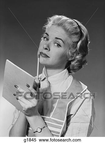 1950S Blond Woman Wearing Apron Writing Pad In Hand Pencil To Chin Thinking View Large Photo Image Stock Photography - 1950S Blond Woman Wearing Apron Writing Pad In Hand Pencil To Chin Thinking. Fotosearch
