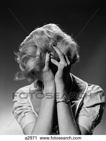 1950S Blond Woman With Headache Holding Head In Hands View Large Photo Image Stock Image - 1950S Blond Woman With Headache Holding Head In Hands. Fotosearch