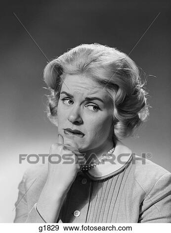 1950S Blonde Woman Fist To Chin Worried Serious Facial Expression View Large Photo Image Stock Photo - 1950S Blonde Woman Fist To Chin Worried Serious Facial Expression. Fotosearch