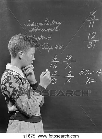 Stock Photography - 1950S Boy At Blackboard Doing Math Multiplication Problem. Fotosearch