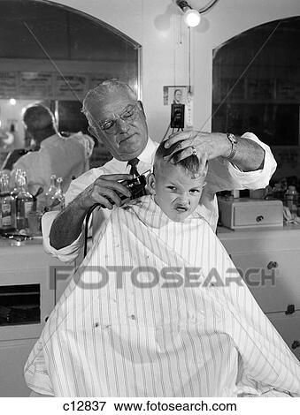 1950S Boy In Barbershop Getting His Hair Cut View Large Photo Image Stock Photo - 1950S Boy In Barbershop Getting His Hair Cut. Fotosearch