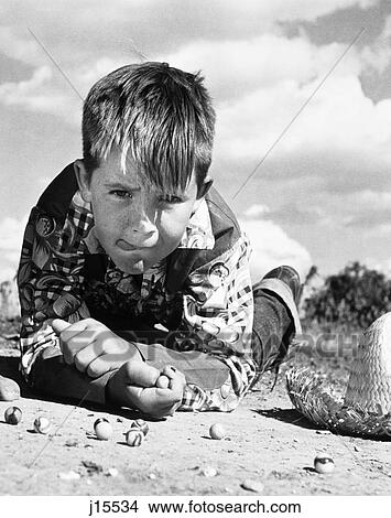1950S Boy Shooting Marbles Outdoor View Large Photo Image Picture - 1950S Boy Shooting Marbles Outdoor. Fotosearch