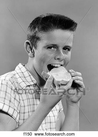 1950S Boy With Crew Cut Eating A Slice Of Bread View Large Photo Image Stock Image - 1950S Boy With Crew Cut Eating A Slice Of Bread. Fotosearch