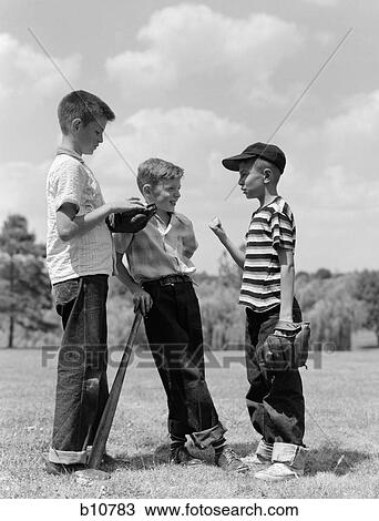 1950S Boys Baseball Threesome One Holding Bat Others Wearing Mitts Having Discussion View Large Photo Image Stock Image - 1950S Boys Baseball Threesome One Holding Bat Others Wearing Mitts Having Discussion. Fotosearch