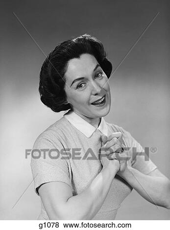 1950S Brunette Woman Smiling Happy Satisfied Proudly Clasping Hands To Chest View Large Photo Image Stock Photo - 1950S Brunette Woman Smiling Happy Satisfied Proudly Clasping Hands To Chest. Fotosearch