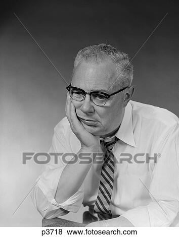 1950S Businessman Glasses Shirt Sleeves Sad Facial Expression Holding Head In Hand View Large Photo Image Stock Photo - 1950S Businessman Glasses Shirt Sleeves Sad Facial Expression Holding Head In Hand. Fotosearch