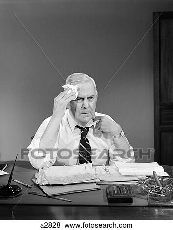 1950S Businessman Sitting At Desk Wiping Forehead With Handkerchief Pulling At Shirt Collar View Large Photo Image Stock Photo - 1950S Businessman Sitting At Desk Wiping Forehead With Handkerchief Pulling At Shirt Collar. Fotosearch