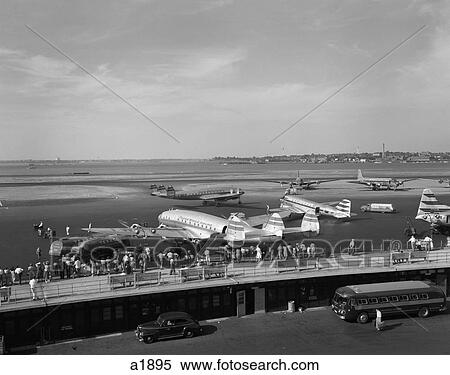 1950S Constellation Four Motor Airplane Fueling And Loading Passengers At Laguardia Airport New York View Large Photo Image Stock Photography - 1950S Constellation Four Motor Airplane Fueling And Loading Passengers At Laguardia Airport New York. Fotosearch