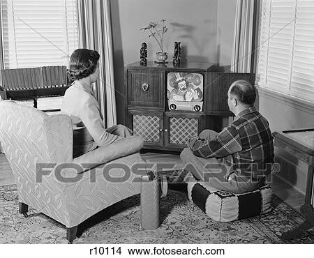 Picture - 1950S Couple Husband Wife Watching Console Television In Living Room. Fotosearch